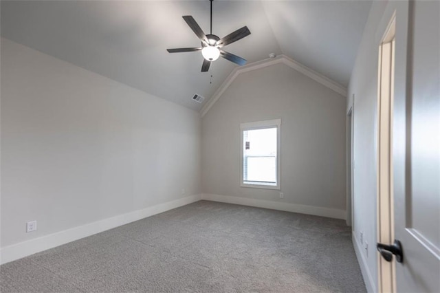 empty room with carpet floors, ceiling fan, and lofted ceiling