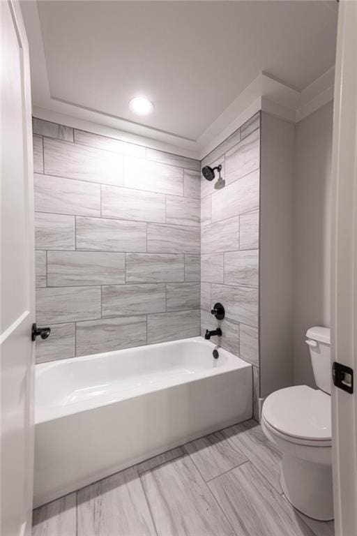 bathroom with shower / bathing tub combination and toilet