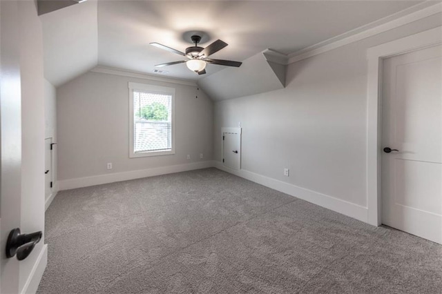 bonus room with ceiling fan, carpet flooring, and vaulted ceiling