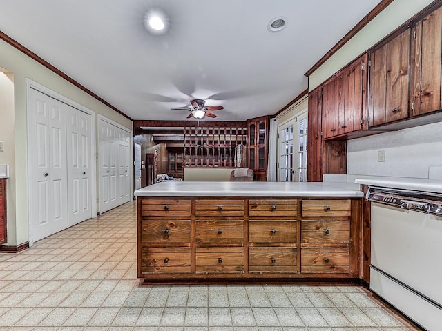 kitchen featuring ceiling fan, ornamental molding, kitchen peninsula, and dishwasher