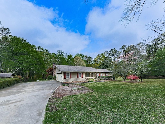 single story home featuring a garage, a front yard, and a porch