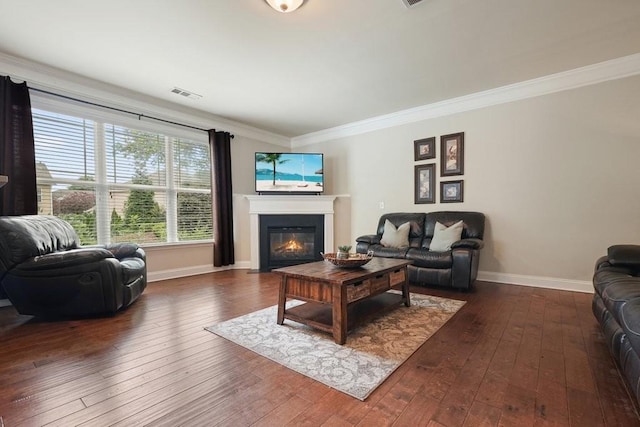 4003 Coachman Ct, Cumming, GA 30040 - living room featuring a fireplace with flush hearth, crown molding, and dark wood-style flooring