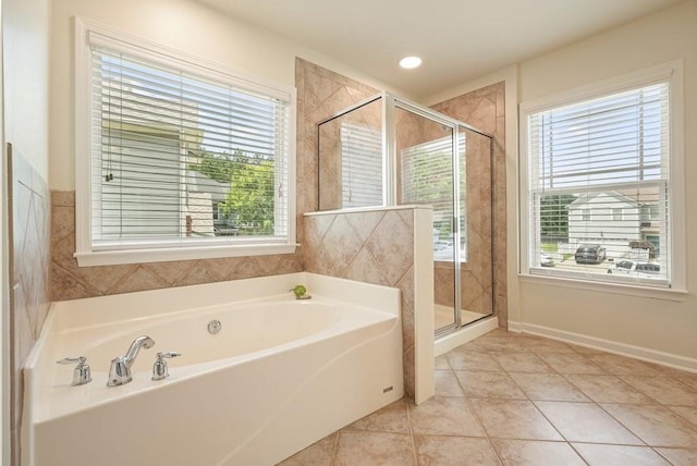 4003 Coachman Ct, Cumming, GA 30040 - bathroom featuring a bath, a shower stall, and tile patterned flooring