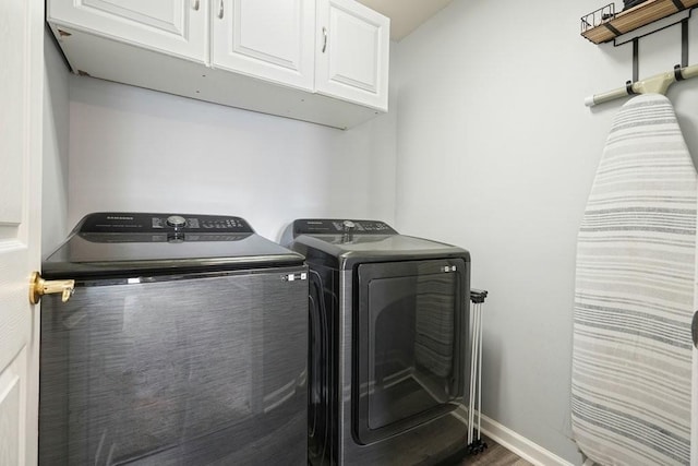 4003 Coachman Ct, Cumming, GA 30040 - laundry room featuring cabinet space, washing machine and clothes dryer, and wood finished floors