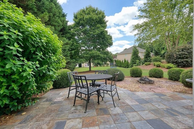 4003 Coachman Ct, Cumming, GA 30040 - view of patio / terrace featuring outdoor dining area and a fire pit