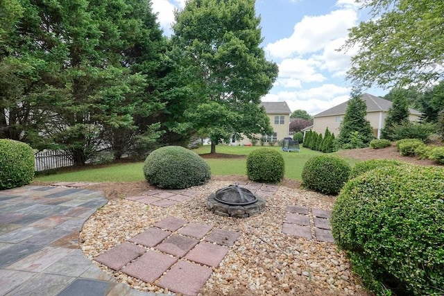 4003 Coachman Ct, Cumming, GA 30040 - view of yard featuring an outdoor fire pit and a patio