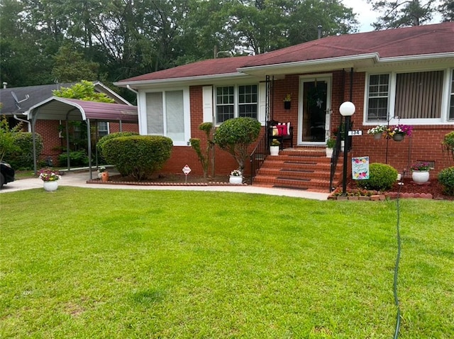 view of front of home with a carport and a front lawn