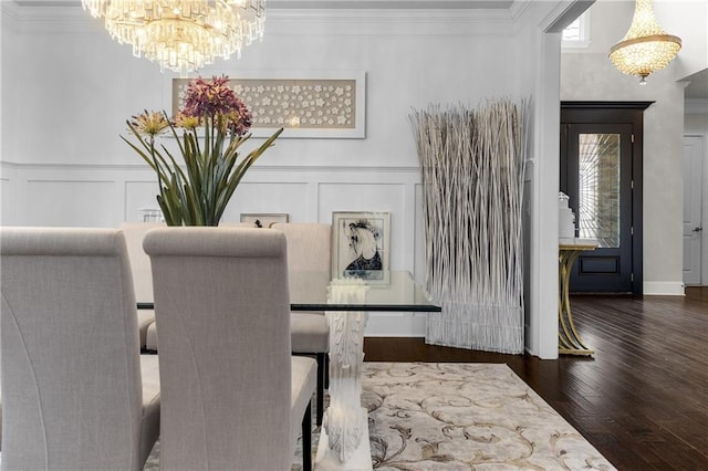 1250 Atherton Park, Roswell, GA 30076 - dining space with a chandelier, a decorative wall, ornamental molding, wood finished floors, and wainscoting