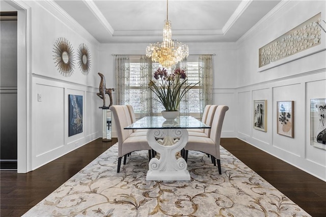 1250 Atherton Park, Roswell, GA 30076 - dining area featuring a decorative wall, a chandelier, a raised ceiling, dark wood-type flooring, and crown molding