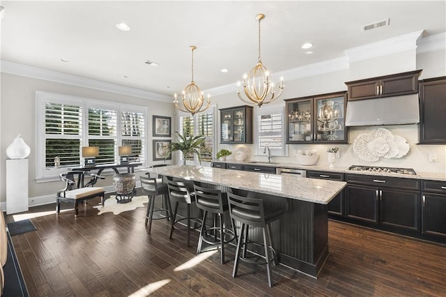 1250 Atherton Park, Roswell, GA 30076 - kitchen featuring stainless steel gas cooktop, a chandelier, a sink, a kitchen bar, and a kitchen island