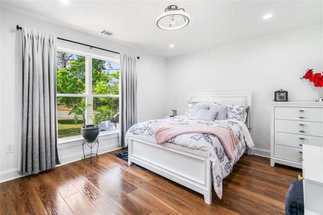 bedroom with visible vents, recessed lighting, and wood finished floors