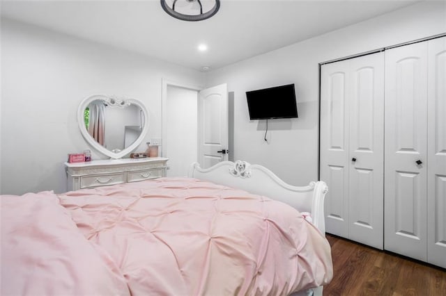 bedroom featuring a closet and dark wood-type flooring