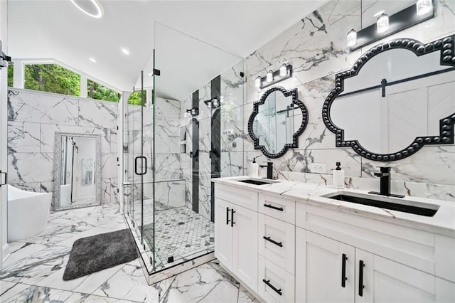 full bathroom featuring tile walls, vaulted ceiling, a marble finish shower, and marble finish floor