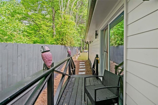 wooden deck featuring fence