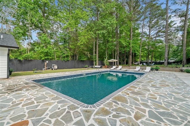 view of swimming pool with a fenced in pool, a patio area, and fence