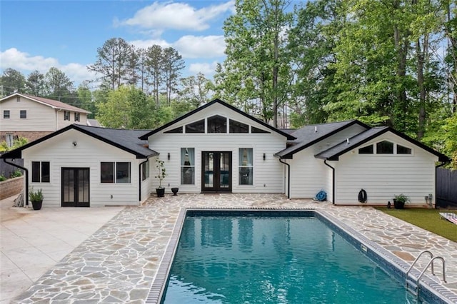 view of swimming pool with a fenced backyard, a fenced in pool, and a patio