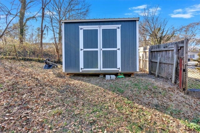 view of shed with fence