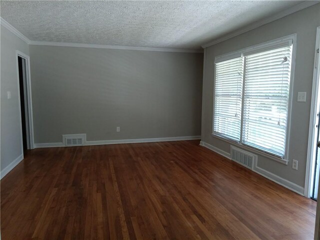 732 Vinson Pl SW, Atlanta, GA 30315 - unfurnished room with a textured ceiling, dark wood-style floors, ornamental molding, and baseboards
