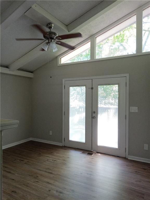 732 Vinson Pl SW, Atlanta, GA 30315 - unfurnished room with french doors, a ceiling fan, wood finished floors, and baseboards