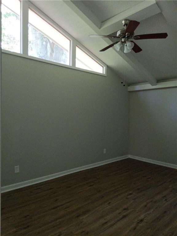 732 Vinson Pl SW, Atlanta, GA 30315 - empty room featuring dark wood-style flooring, a ceiling fan, and baseboards