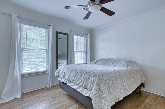 4635 Walden Trce, Peachtree Corners, GA 30092 - bedroom featuring multiple windows, wood finished floors, baseboards, and ornamental molding
