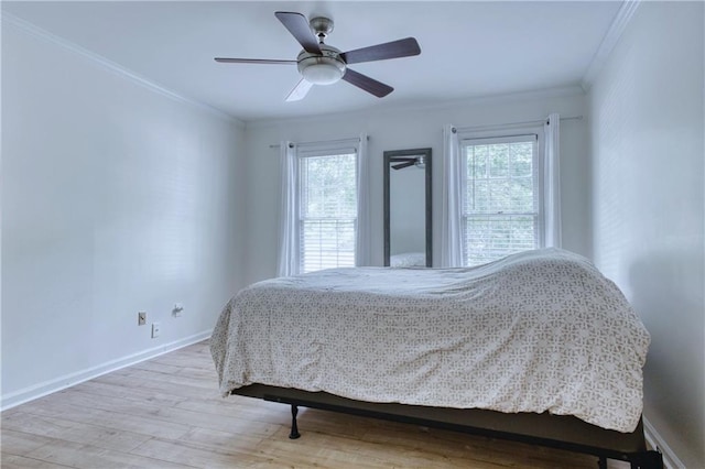 4635 Walden Trce, Peachtree Corners, GA 30092 - bedroom featuring ornamental molding, multiple windows, wood finished floors, baseboards, and a ceiling fan