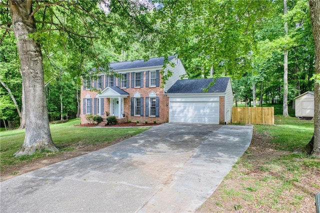 4635 Walden Trce, Peachtree Corners, GA 30092 - colonial home with concrete driveway, a garage, a shed, and brick siding