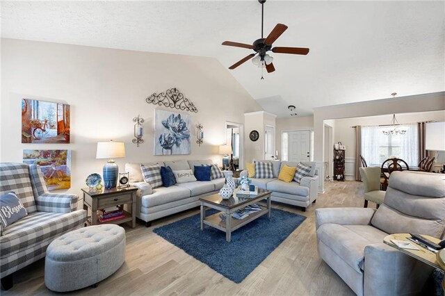 102 Autumn Brooke Trl, Dallas, GA 30157 - living area featuring a ceiling fan, a chandelier, light wood-type flooring, and high vaulted ceiling