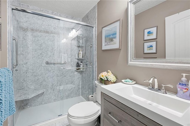 102 Autumn Brooke Trl, Dallas, GA 30157 - bathroom featuring toilet, a stall shower, a textured ceiling, and vanity