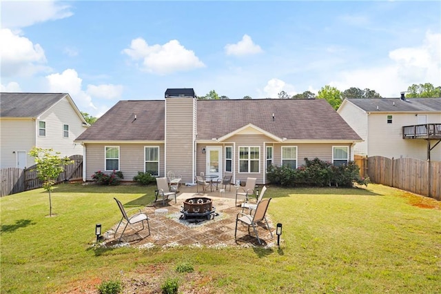 102 Autumn Brooke Trl, Dallas, GA 30157 - back of property with a fire pit, a chimney, and a patio