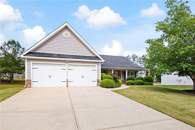 102 Autumn Brooke Trl, Dallas, GA 30157 - view of front of home with driveway, a front lawn, stone siding, an attached garage, and covered porch