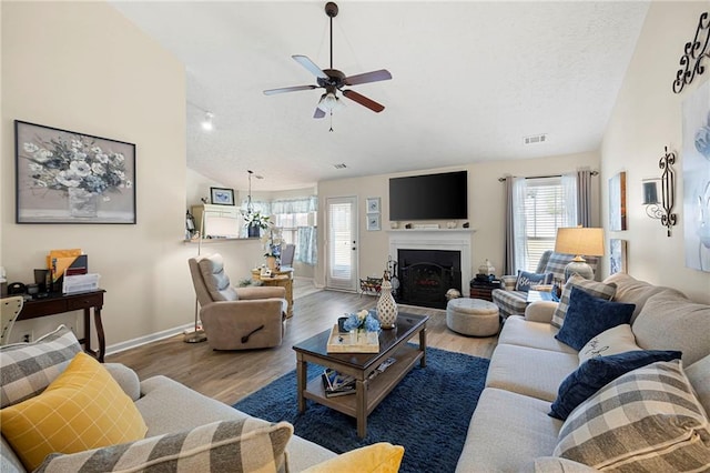 102 Autumn Brooke Trl, Dallas, GA 30157 - living area featuring lofted ceiling, ceiling fan, baseboards, wood finished floors, and a fireplace