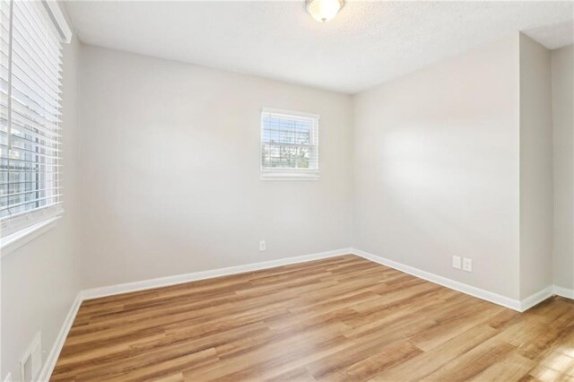 unfurnished room featuring light wood-type flooring