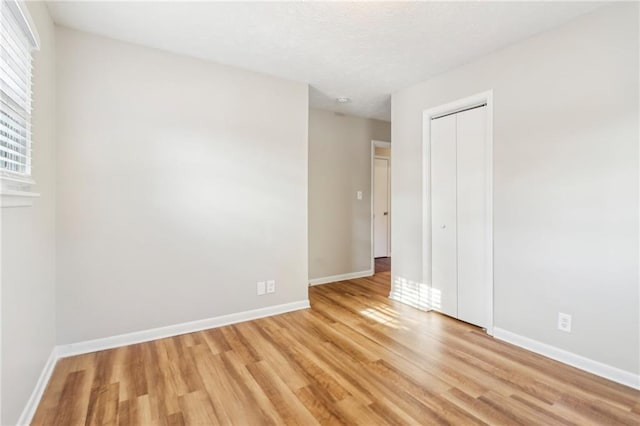 spare room featuring light hardwood / wood-style flooring