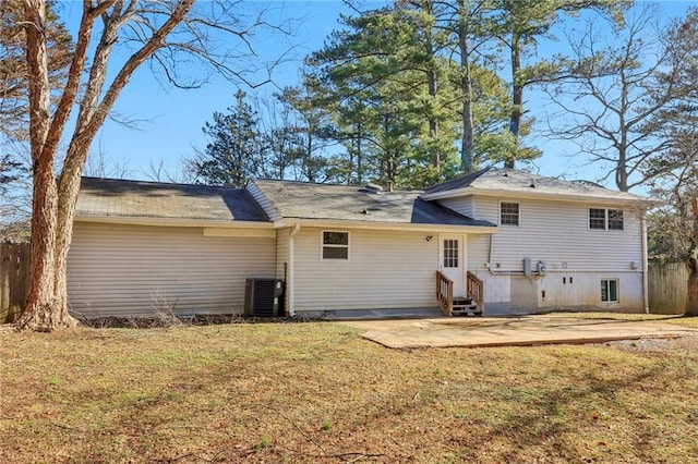 back of property featuring central AC, a yard, and a patio