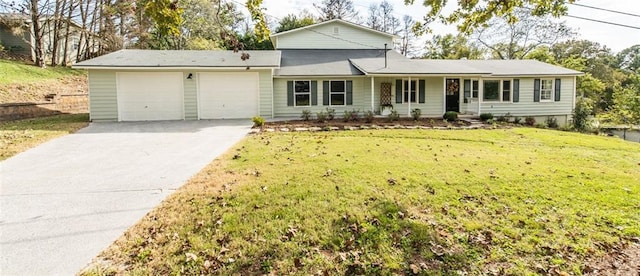 view of front facade with a front yard and a garage