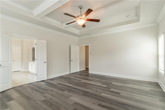 unfurnished room with a ceiling fan, dark wood finished floors, crown molding, baseboards, and beam ceiling