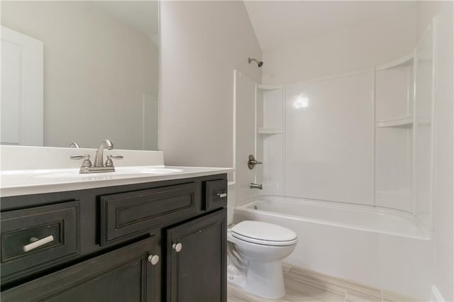 full bathroom with vaulted ceiling, toilet, tub / shower combination, and vanity