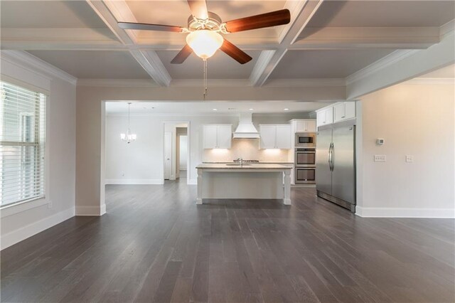 kitchen featuring built in appliances, custom exhaust hood, coffered ceiling, beam ceiling, and baseboards