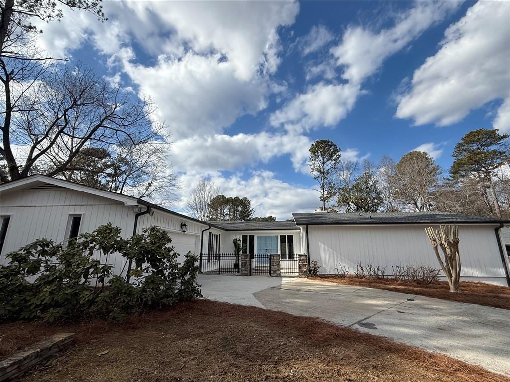 back of property with a garage