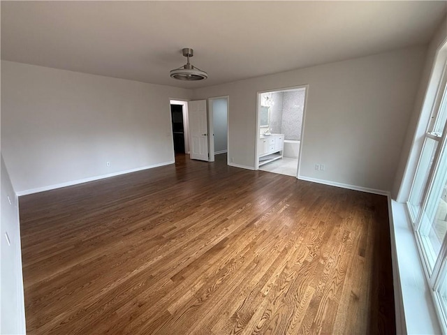 unfurnished room featuring dark hardwood / wood-style flooring