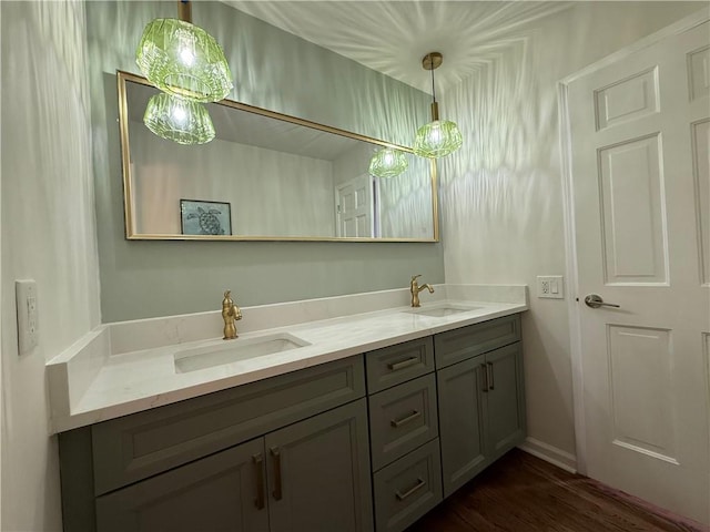 bathroom featuring hardwood / wood-style flooring and vanity