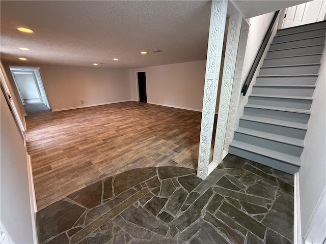 basement with a textured ceiling