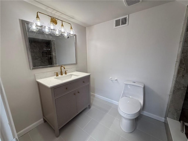 bathroom featuring tile patterned floors, toilet, and vanity