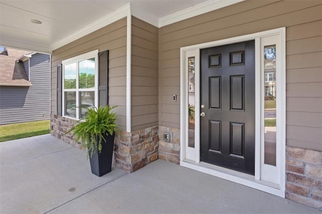 doorway to property featuring a porch