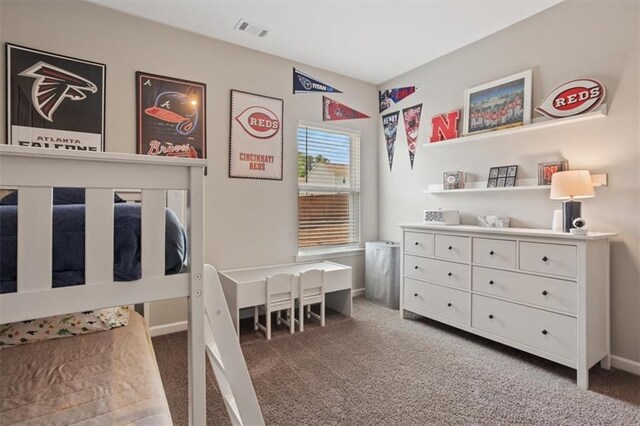 carpeted bedroom featuring baseboards