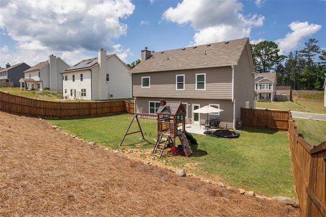 back of property featuring a patio and a residential view