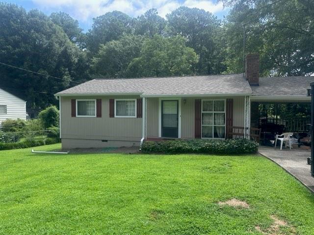 400 Jon Scott Dr, Alpharetta, GA 30009 - ranch-style house featuring a front yard, a chimney, crawl space, and an attached carport