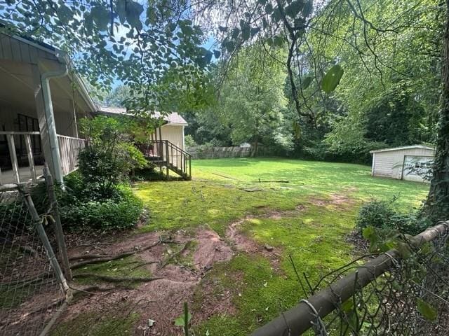 400 Jon Scott Dr, Alpharetta, GA 30009 - view of grassy yard featuring stairs and an outbuilding
