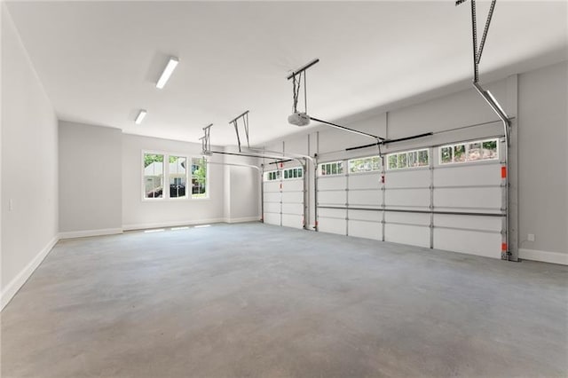 4860 Grandview Ct, Flowery Branch, GA 30542 - garage with baseboards and a garage door opener